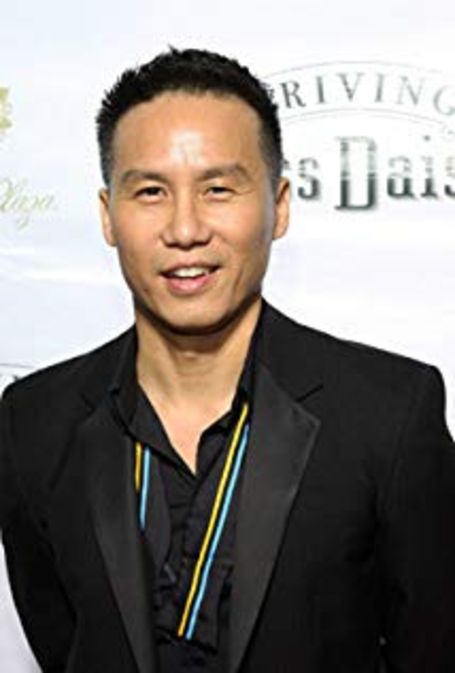 wong n the red carpet wearing a black suit 
